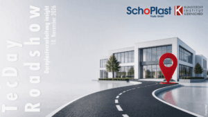KI-generiertes Titelbild der TecDay Roadshow mit einer Strasse, die zu einem Bürogebäude führt. Davor ist ein großes, rotes 3D-Standort-Icon platziert.